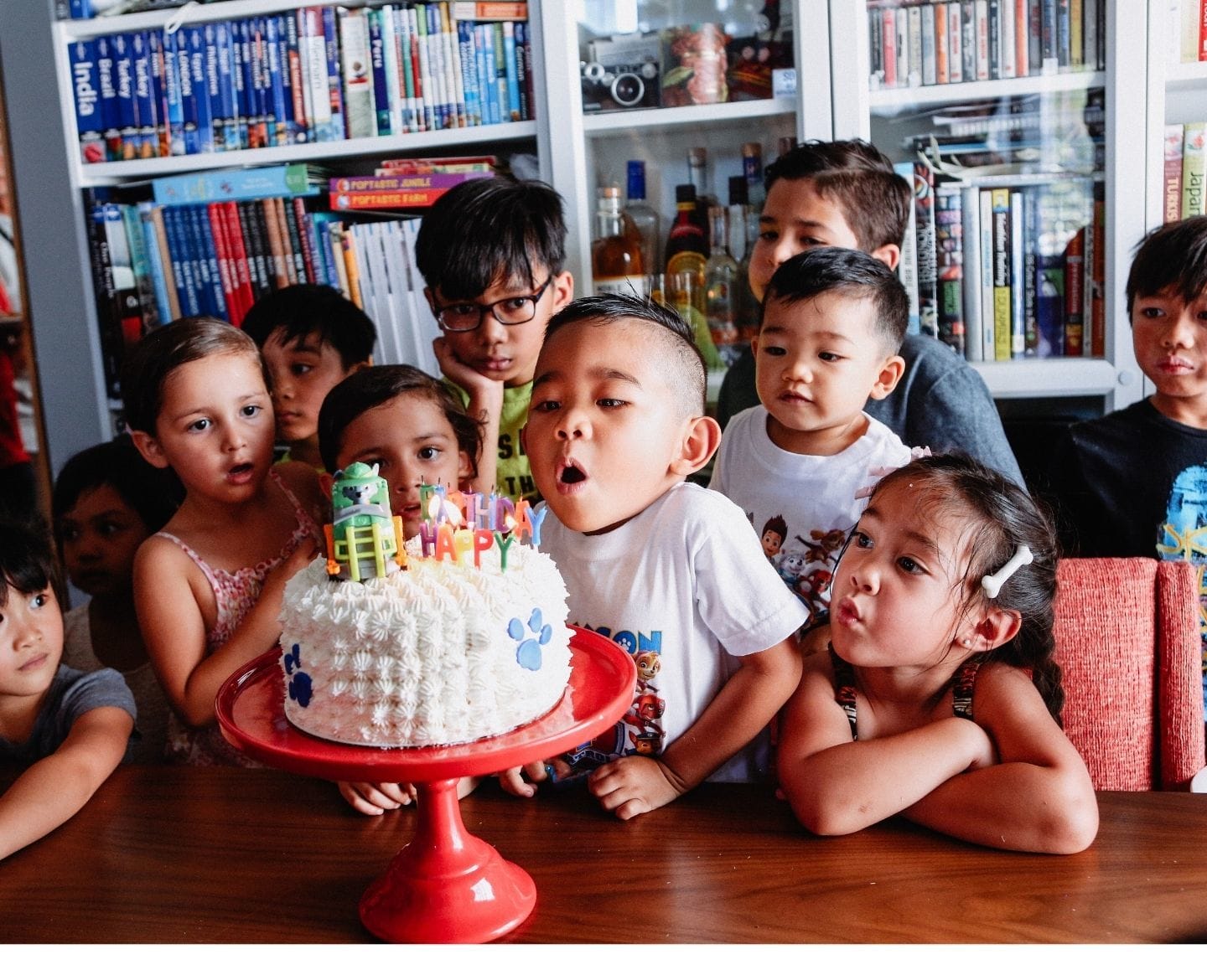 If you love ‘fiver parties’, you’ll really love this alternative to a no-gift birthday party no-gift birthday party: diverse group of kids around birthday cake