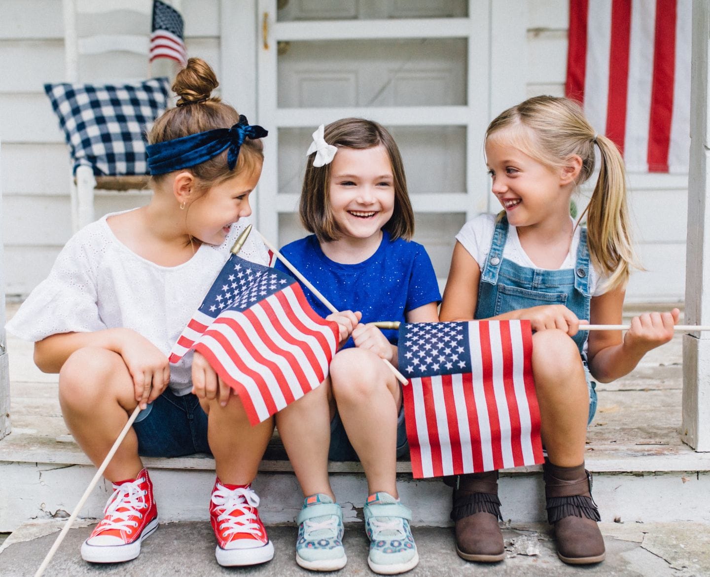 kids holding american flags - Motherly
