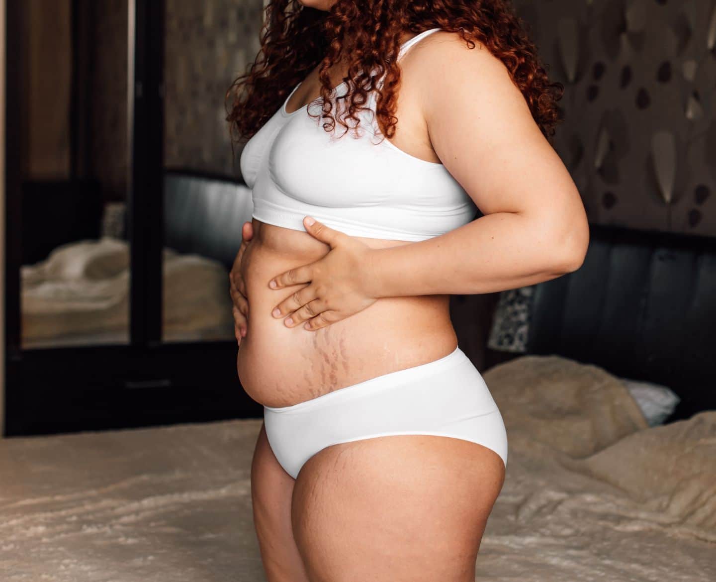 My postpartum body made me feel less sexy—and I’m not alone closeup of woman's postpartum body