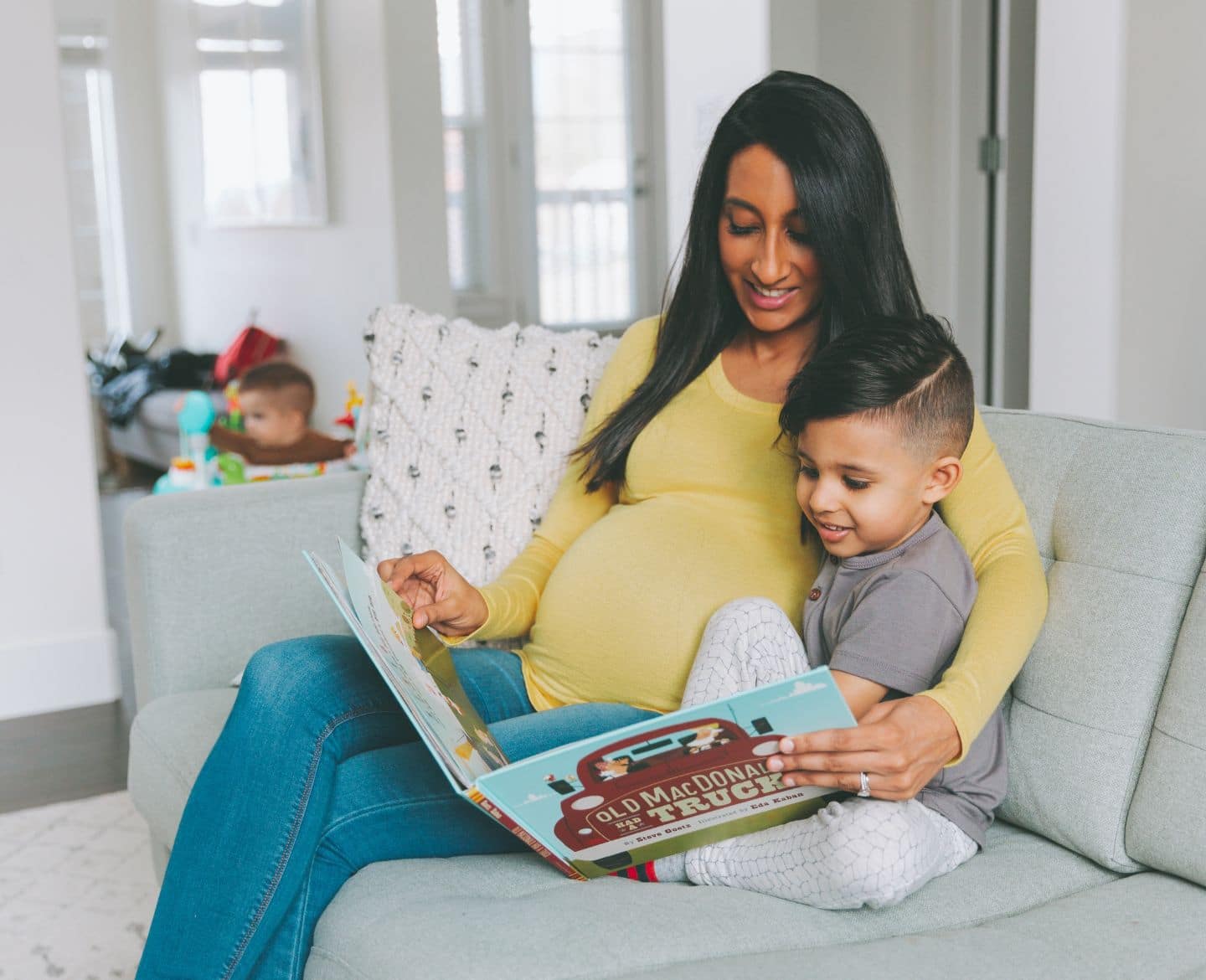 10 wellness books that help toddlers deal with big emotions pregnant mom reading to son