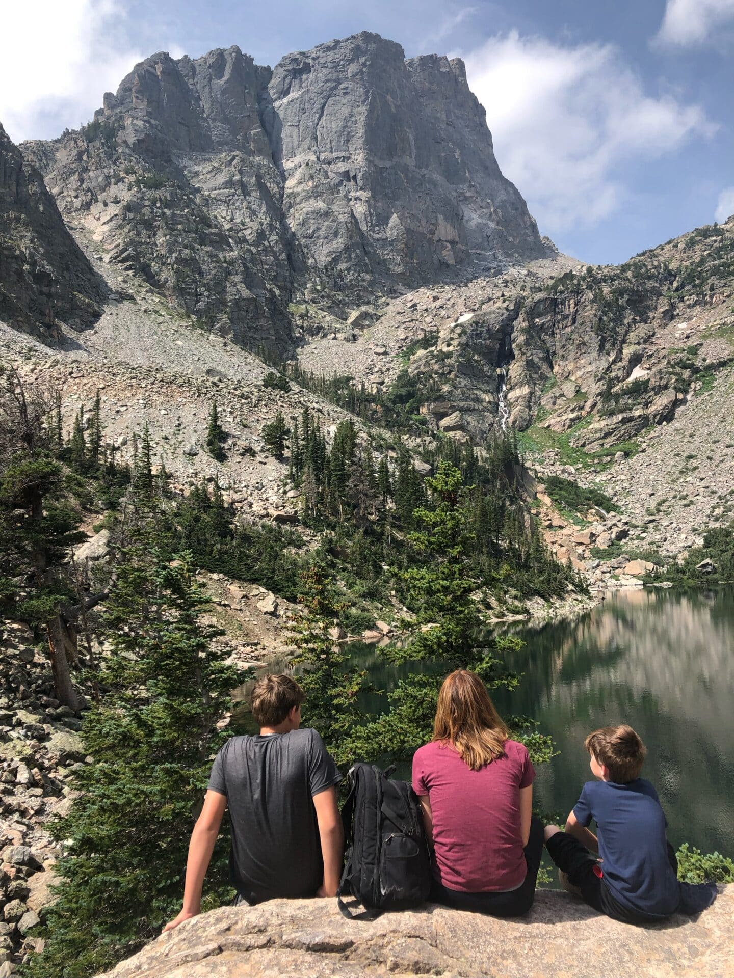Mom and two sons at mountain lake