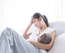 Let’s normalize talking about how hard breastfeeding is stressed mom breastfeeding child