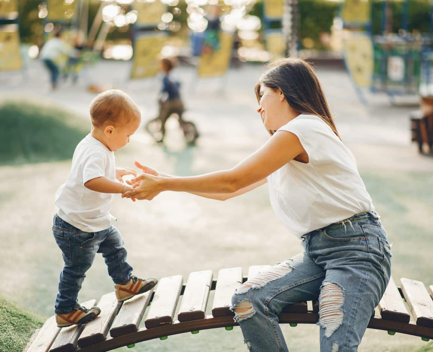 I’m an antisocial mom raising a social kid mom and son playing on playground