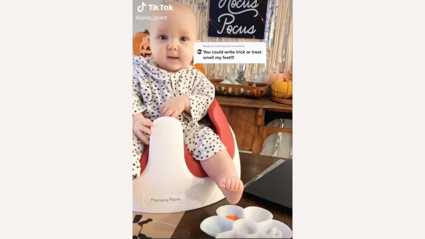15 fun and spooky Halloween crafts for kids baby sitting in a bumbo seat getting ready to make Halloween crafts- Halloween crafts