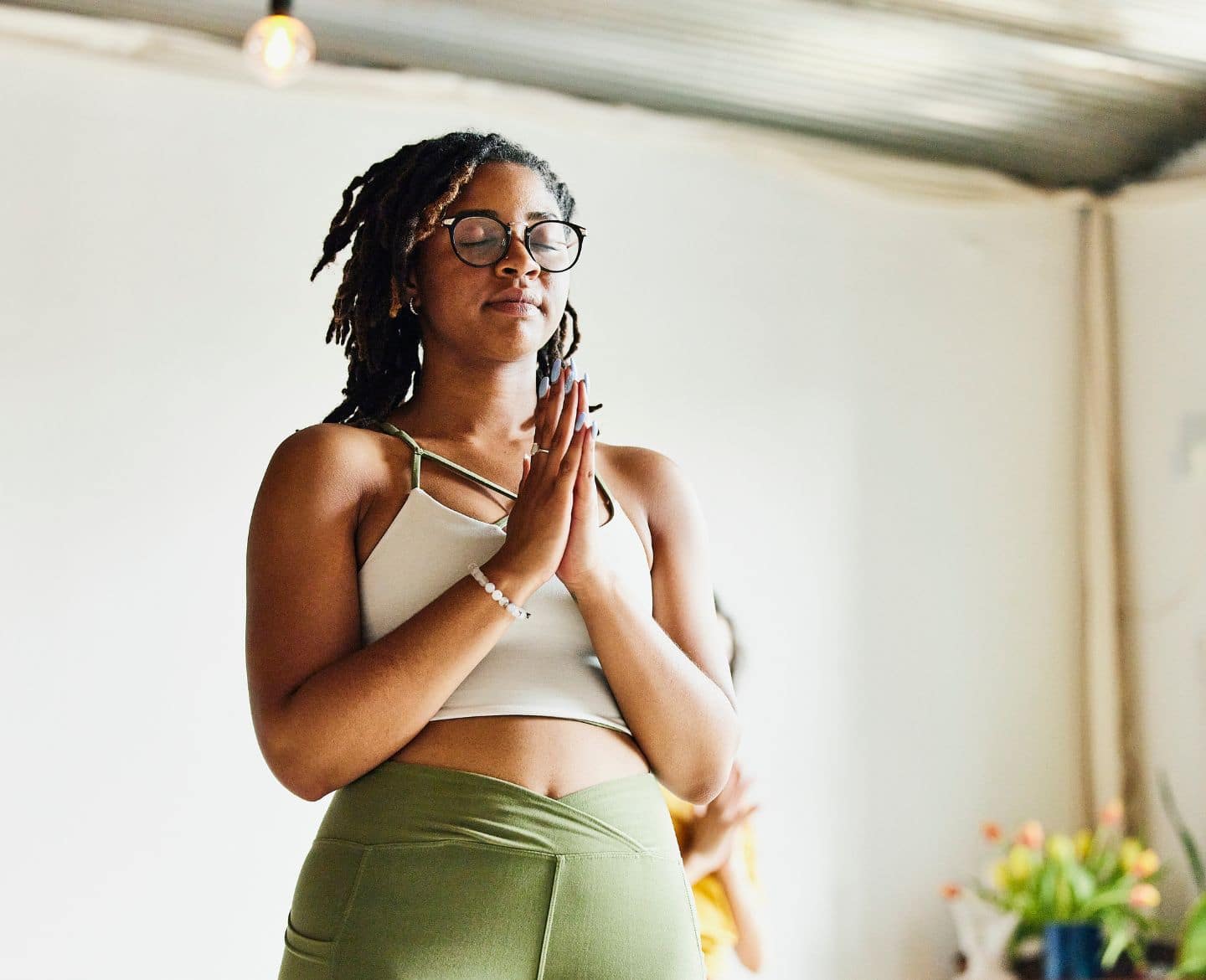 Motherhood has made me stop seeing my hormones as the enemy—and recognize them as the miracle they are woman doing yoga