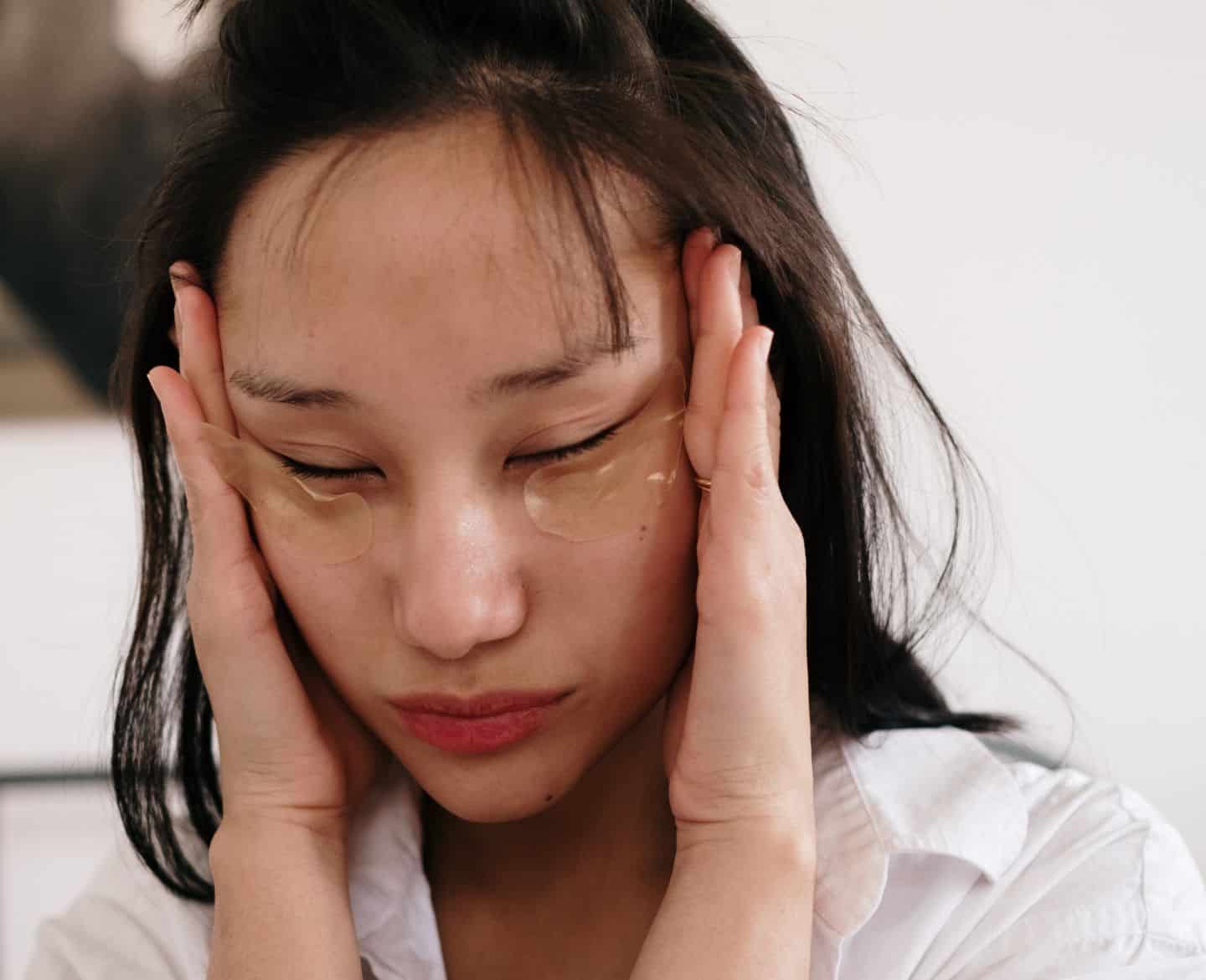 Mom Guilt is a symptom of a much deeper problem woman with hands on face and wearing eye masks