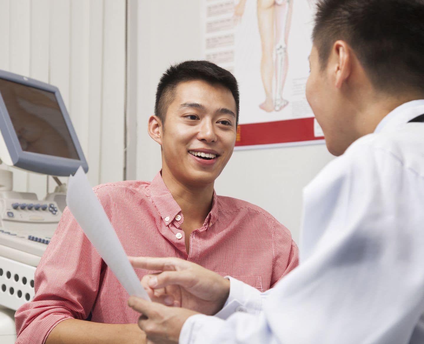 Men are requesting vasectomies in record numbers after Roe ruling young man talking to doctor in office