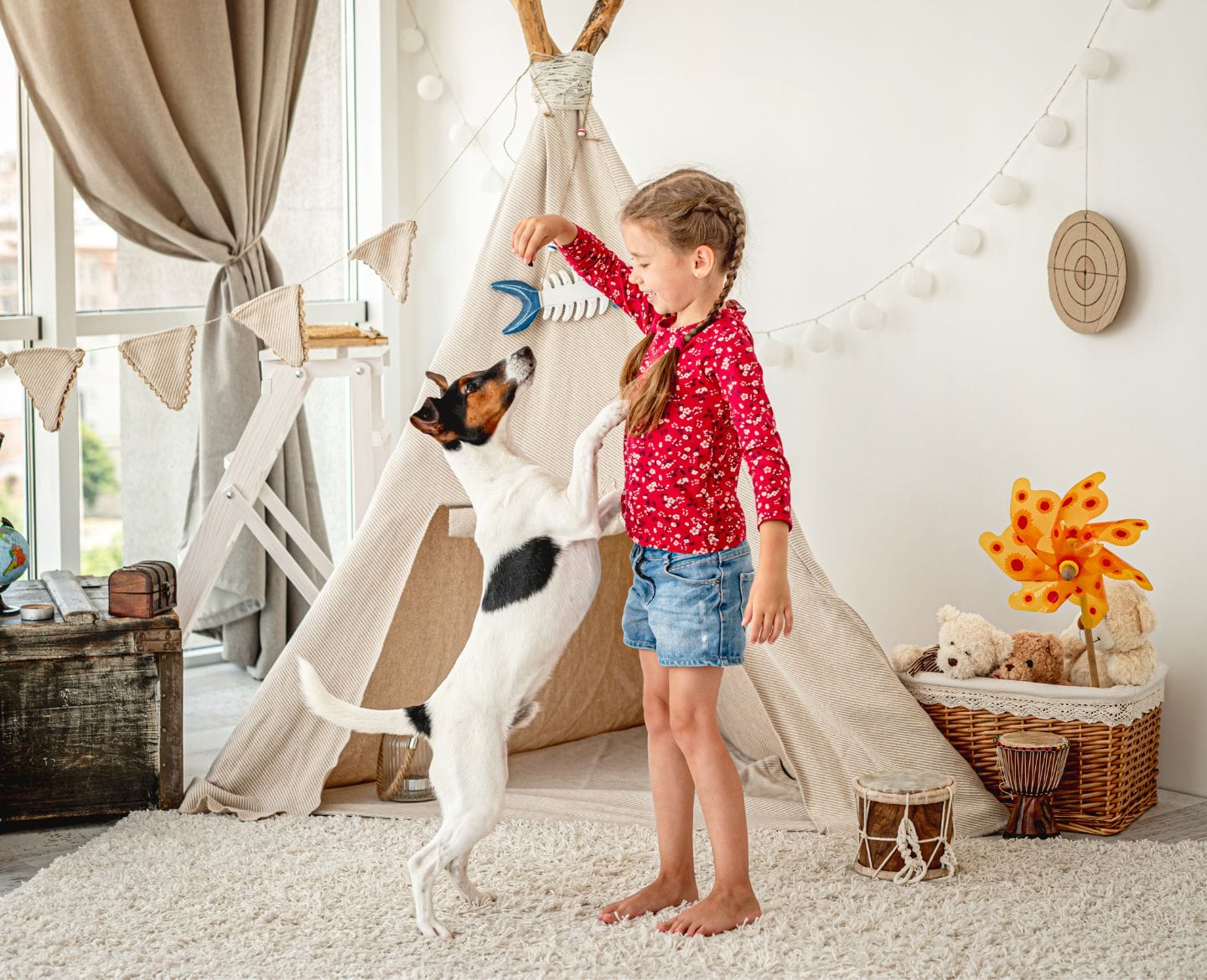 5 signs your child is ready for a family pet girl playing with dog- family pet