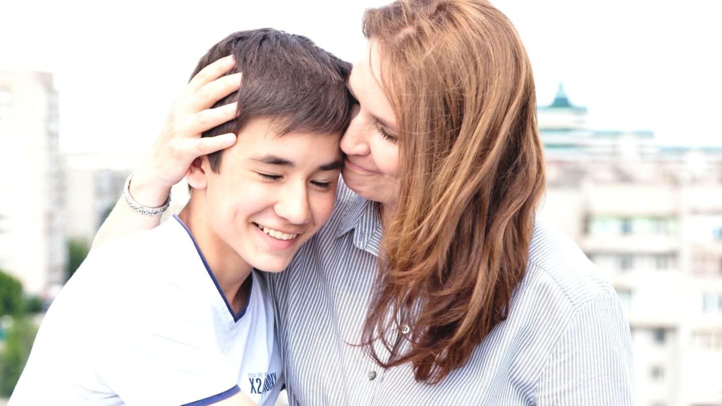 Your parenting style can reduce your child’s risk of substance abuse mom embracing teenage son in a display of how parenting styles can act as substance abuse prevention
