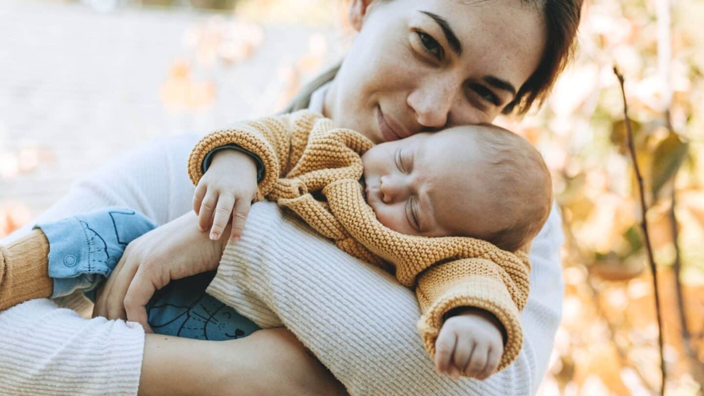 Taking vitamin D during pregnancy may lower your baby’s risk of eczema mother holding baby in her arms - benefits of taking vitamin d during pregnancy