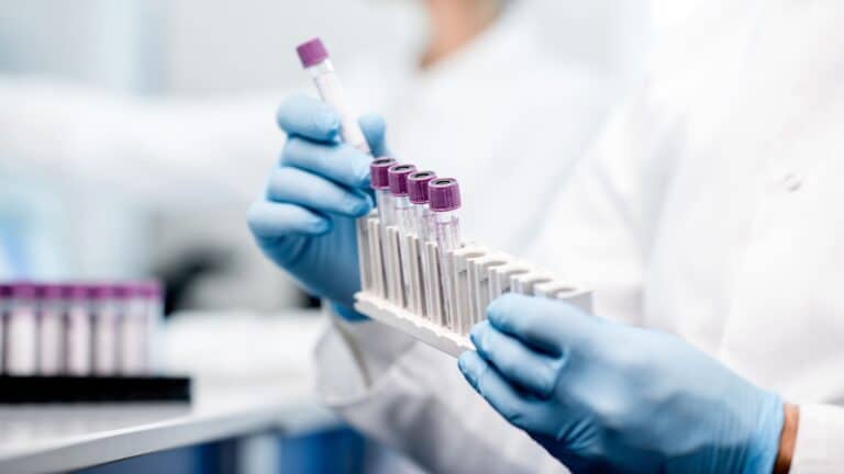 I’m a chemical engineer creating the first formula that mirrors breastmilk—and I need your help woman using test tubes in a lab