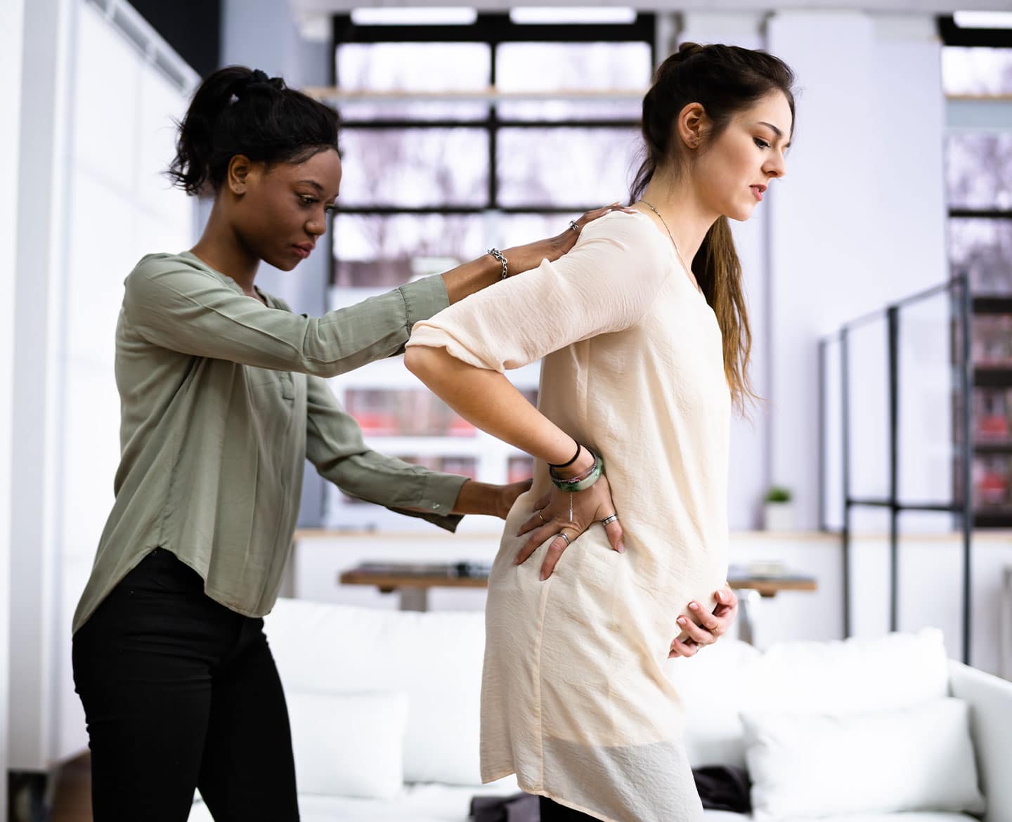 What is a doula and why do I need one? doula assisting pregnant woman
