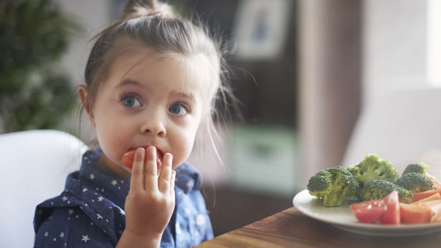 Can food influence your child’s mood? Yes, says a pediatric dietitian girl eating mood boosting foods