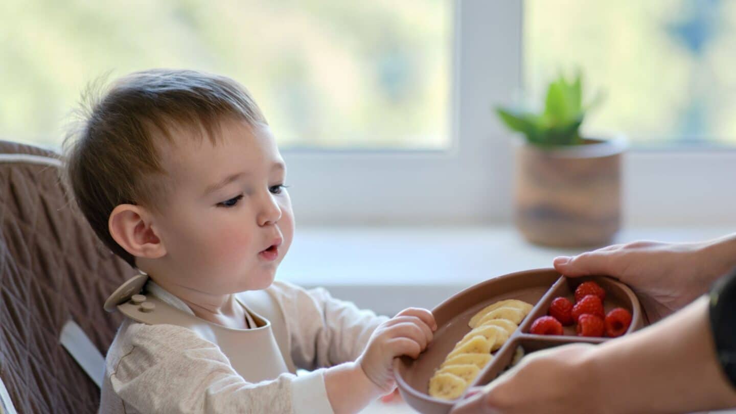 9 types of foods to fuel brain development from a pediatric dietitian little boy eating brain food