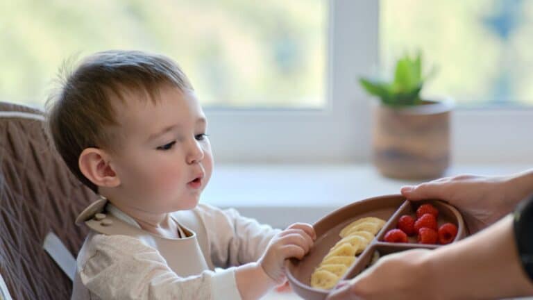 9 types of foods to fuel brain development from a pediatric dietitian little boy eating brain food
