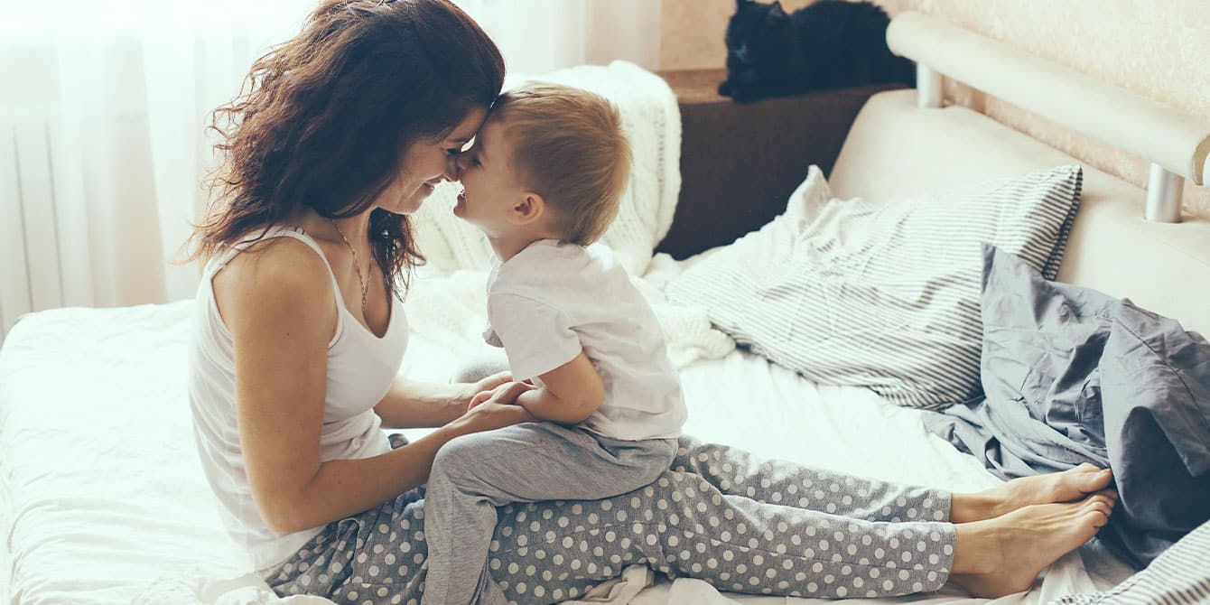 How to choose a guardian for your child: 7 questions to ask Mother relaxing with son at home - how to choose a guardian for your child