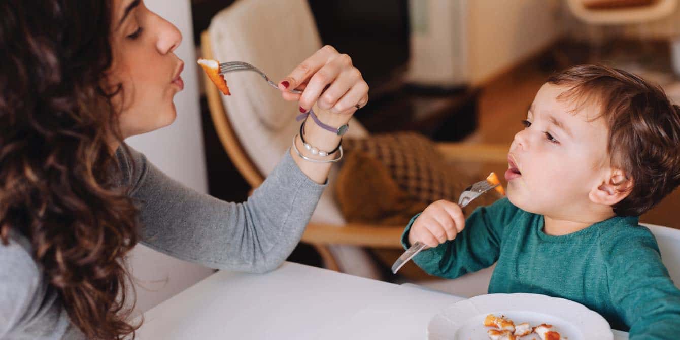 Just serve the dinosaur chicken nuggets, says this food writer and mom mom eats dinosaur nuggest with kids as she read tips for feeding kids