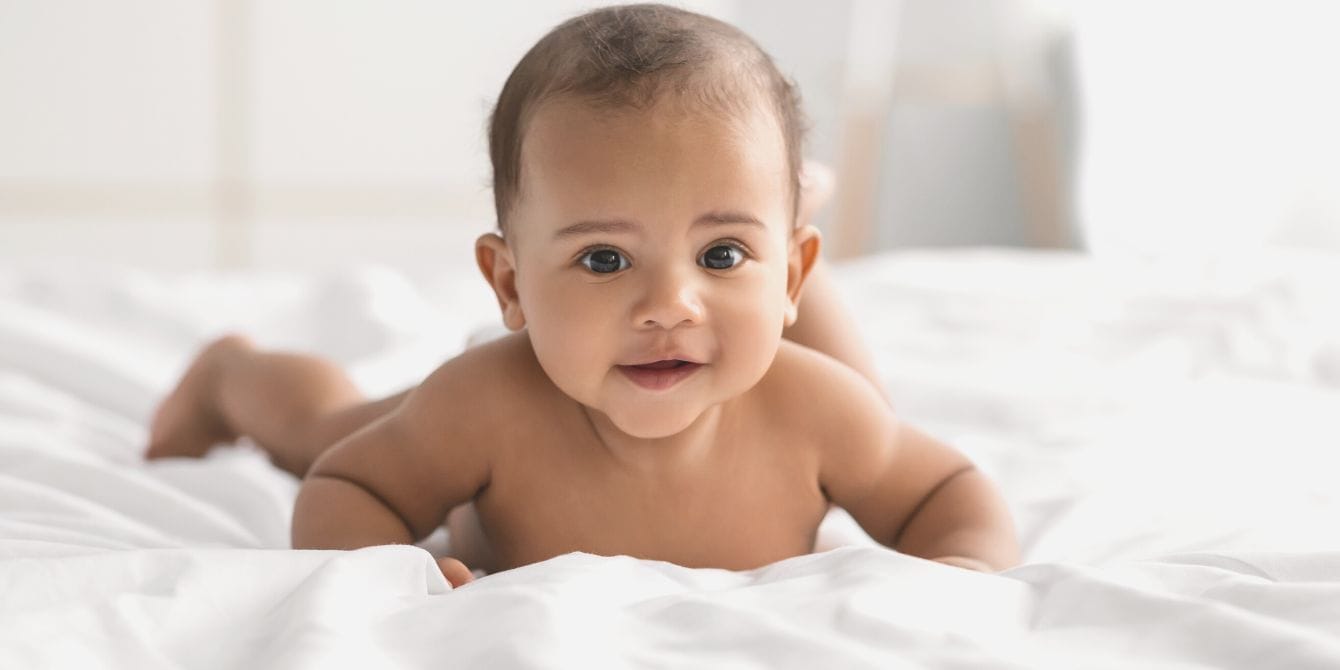 These will be the most popular baby names of 2023 happy baby laying on bed