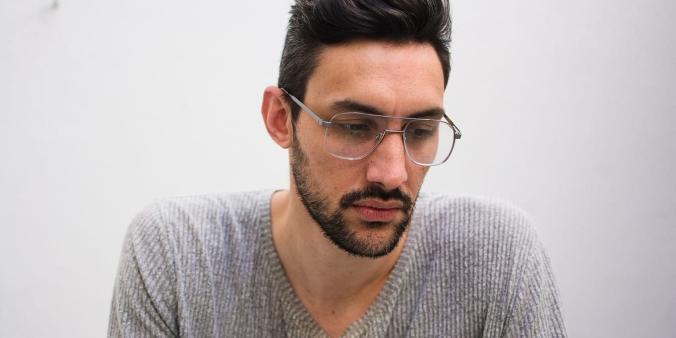 What is paternal depression? We need to talk about men’s mental health, too man in glasses looking sad - paternal depression