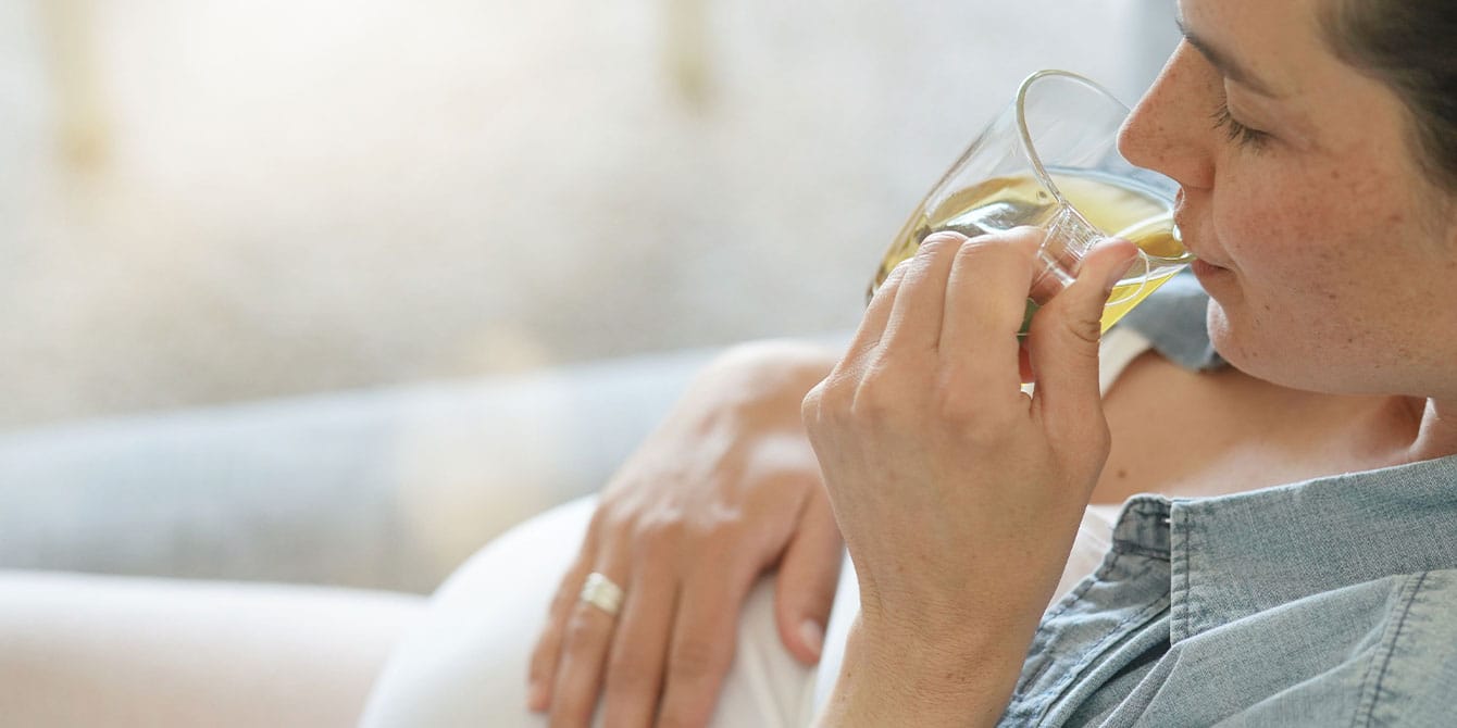 Is it safe to take antidepressants during pregnancy? Pregnant woman drinking hot tea - considering the safety of antidepressants during pregnancy
