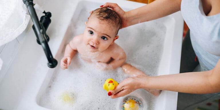 14 bath safety tips for babies and kids of all ages baby taking a bubble bath - bath safety tips