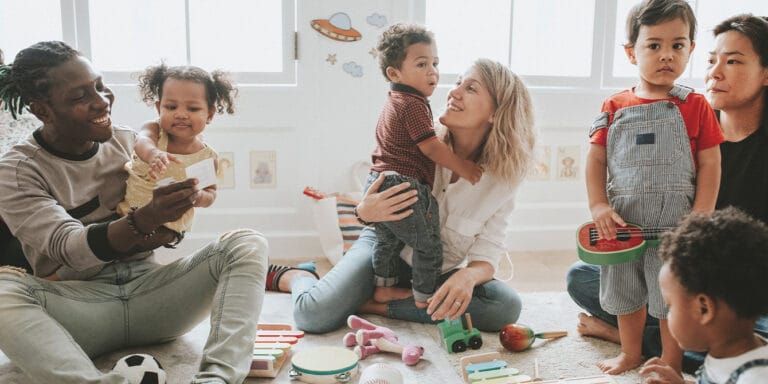 7 ways to raise inclusive kids diverse children enjoying playing toys - raising inclusive kids