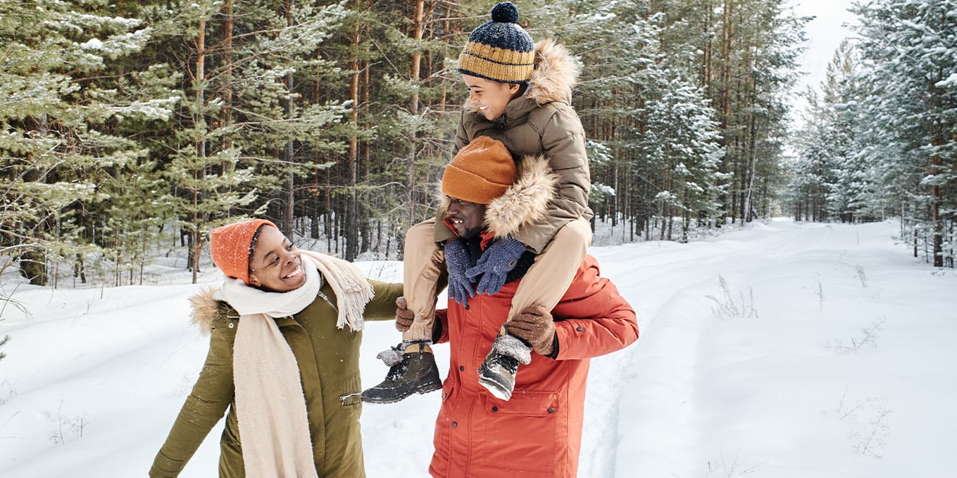7 eco-friendly winter activities for kids family with child on winter nature walk in snow