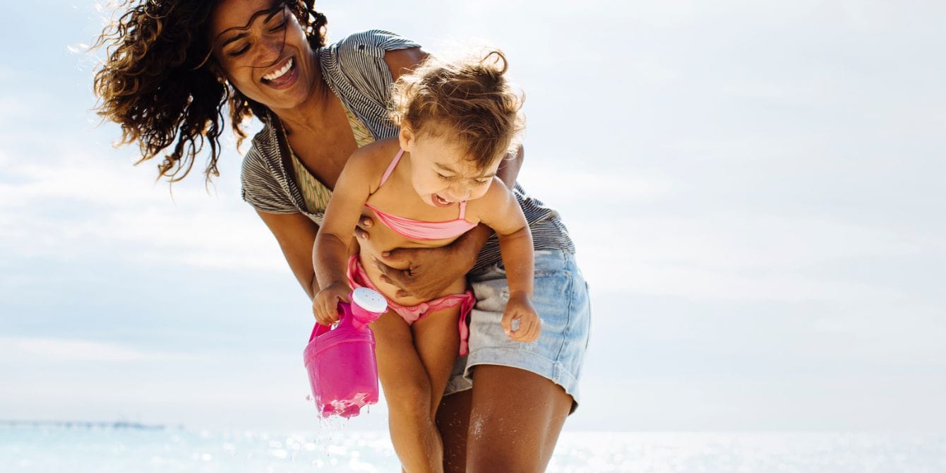 15 outdoor activities for kids that will nurture a love of nature woman and small child having fun doing outdoor activities