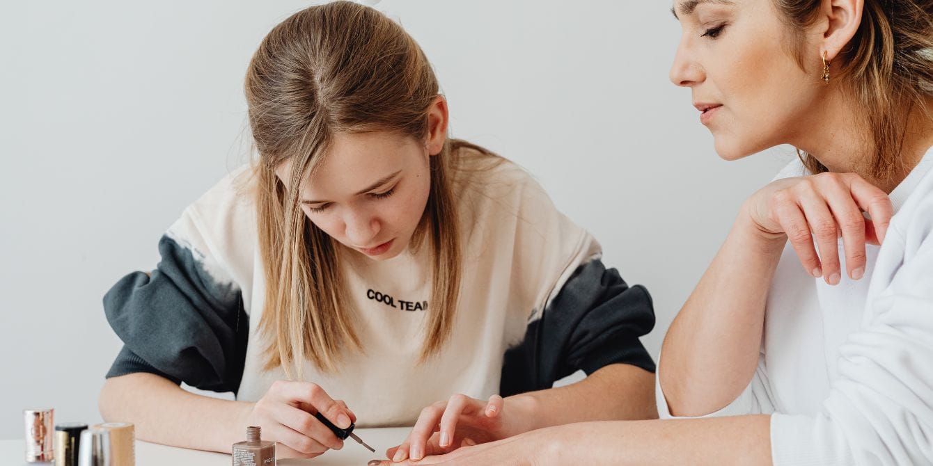 Kids should be getting the HPV vaccine at age 9, experts say daughter paints mom's nails - starting hpv vaccine early at age 9