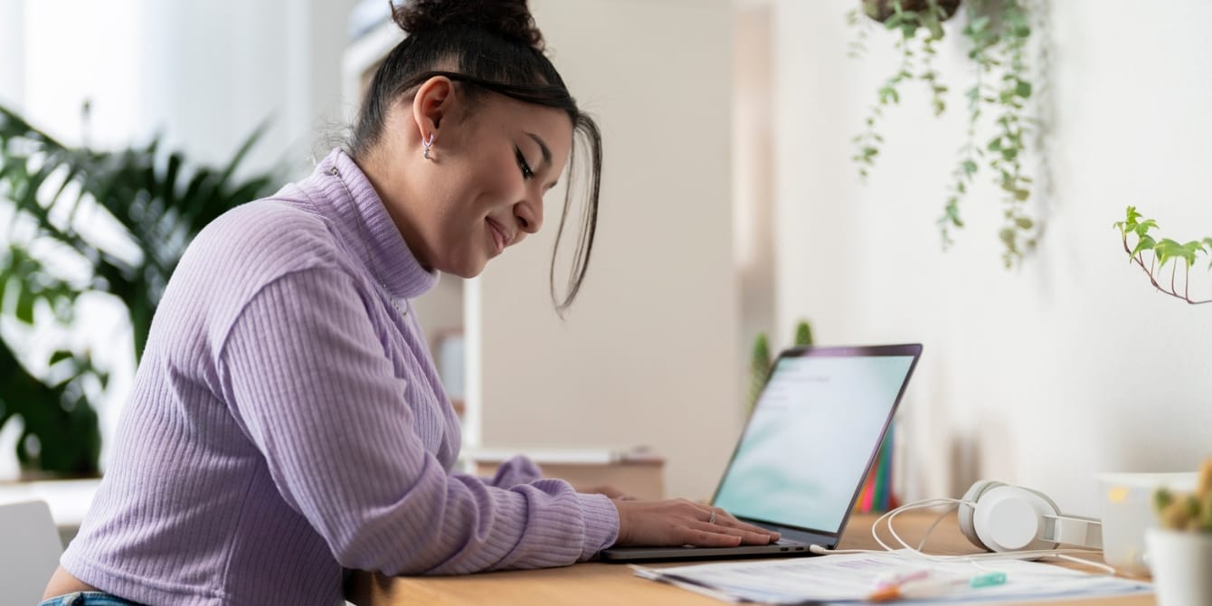 My career is my refuge and it makes me a better mom mom at computer thinking her career makes her a better mom