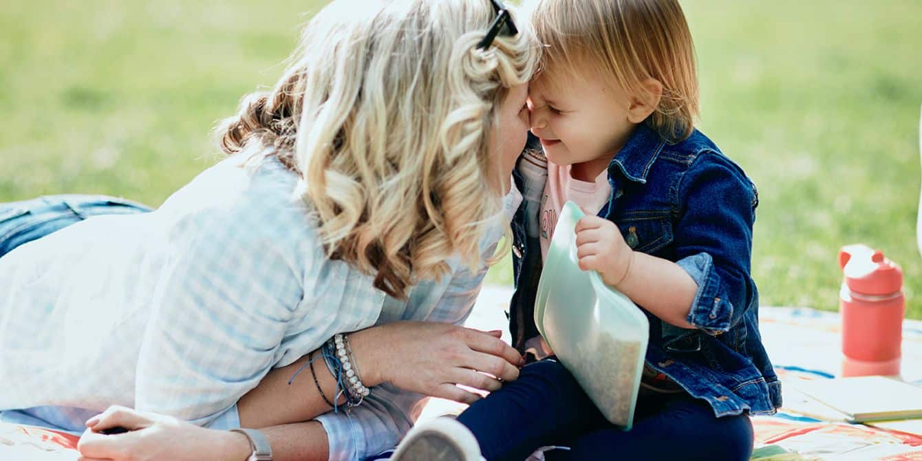 I made these simple sustainable tweaks to my family’s lifestyle—and we’re happier for it mom teaching her child sustainable habits by using Stasher bags