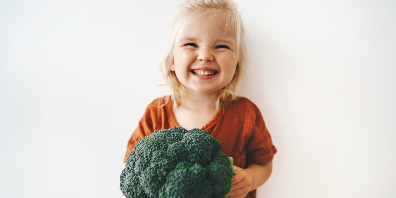 My 5-year-old asked to go plant-based: This is what we learned child wants to be a vegetarian holding a broccoli