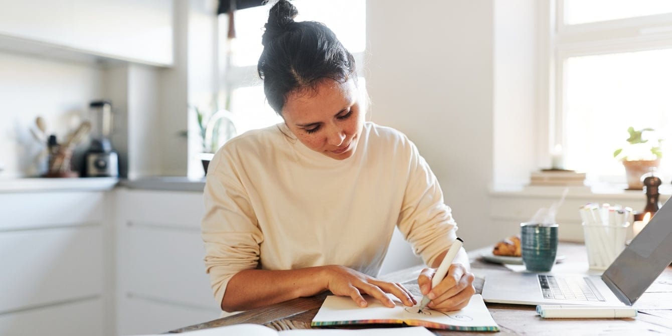 woman journaling to craft a gratitude practice that helps with the stress of being a mom