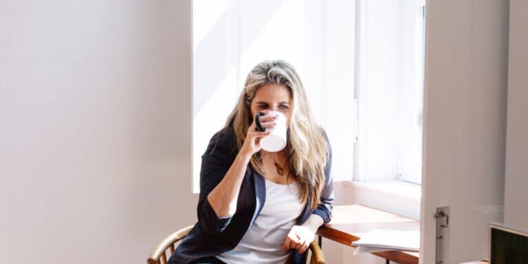 FDA approves new menopause drug to treat hot flashes middle aged woman drinking coffee - menopause drug