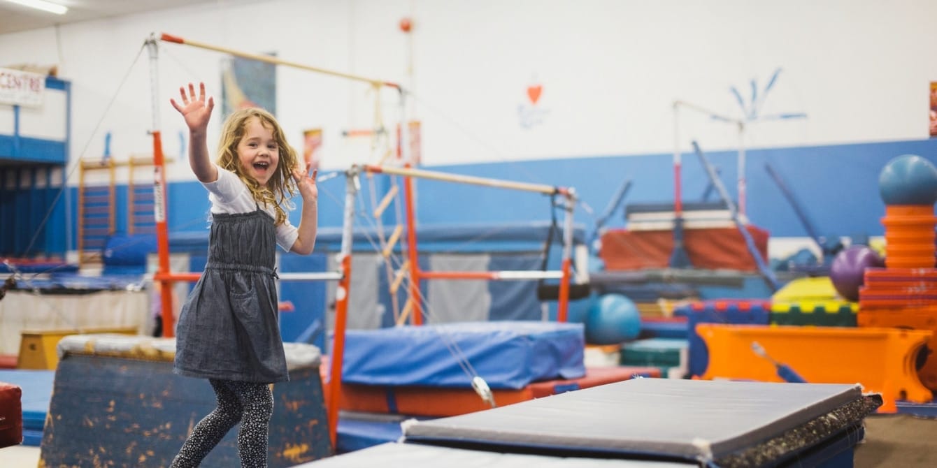 3 long-lasting benefits of summer camp for kids summer camp benefits for kids - girl playing at the little gym