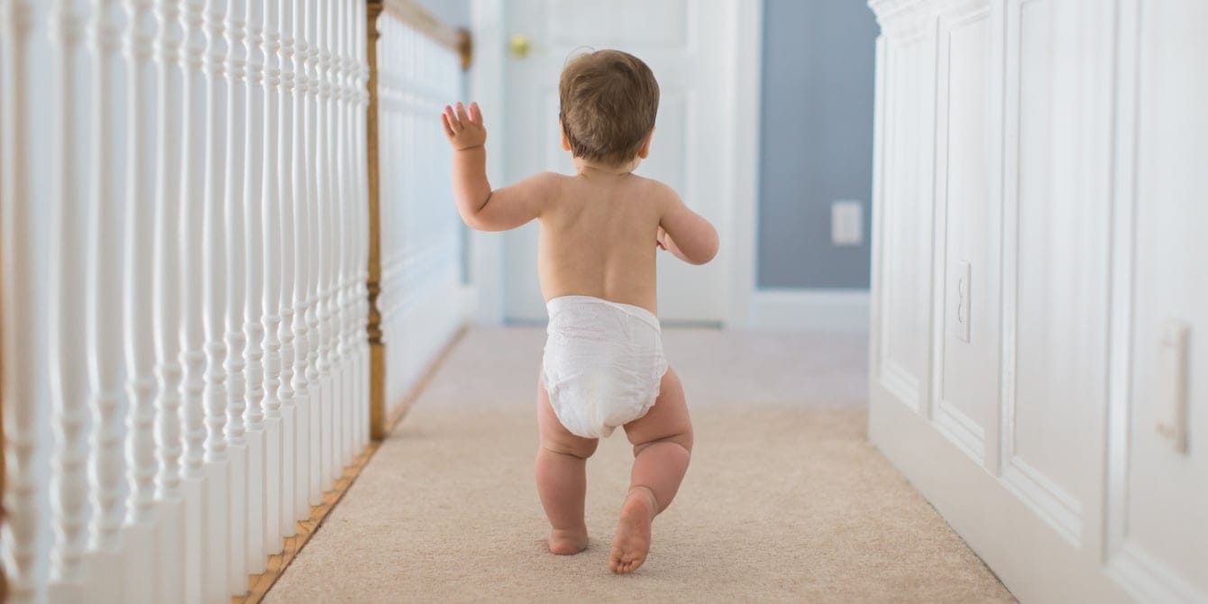 18-month-old health & growth guide toddler baby boy walking away - 18-month-old weight