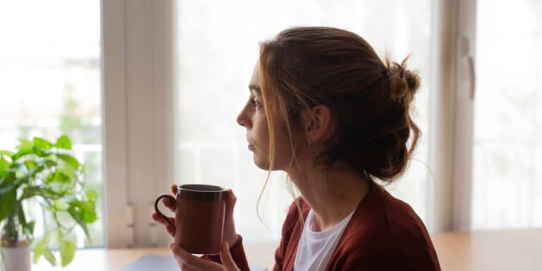 To my village: Don’t let my infertility struggles affect our friendships mom thinking that her infertility affects friendships while drinking coffee
