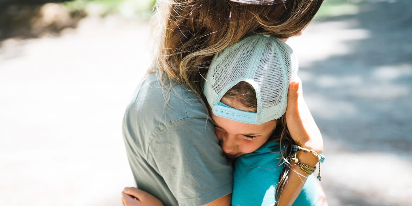 How do you teach kids about hope? mom and daughter hugging outside - teach kids about hope