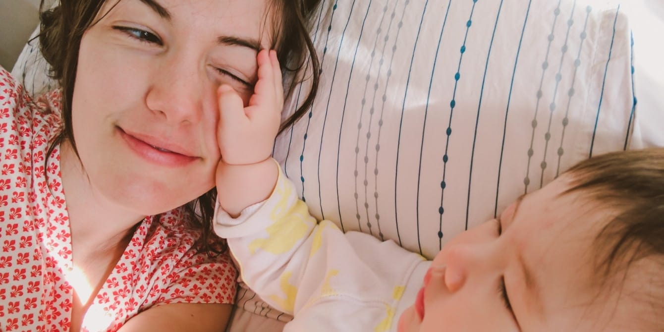 I’m not a picture-perfect mother and that’s OK mom cuddling with baby knowing she's an imperfect mother