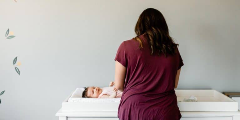 Finding my meaning as a SAHM mom changing baby's diaper wondering how to find meaning as a SAHM
