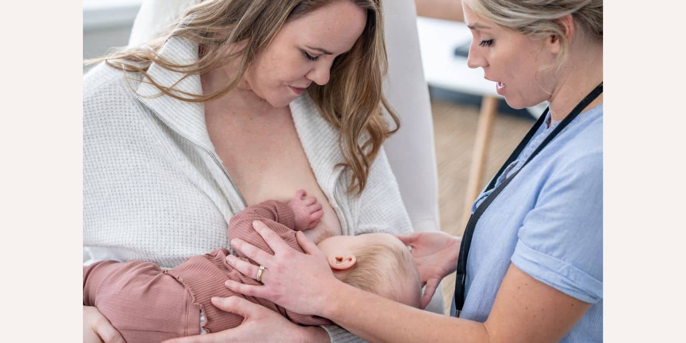 Lactation consultants should be covered by your insurance—this initiative is making sure it happens Lactation consultant helps new mom