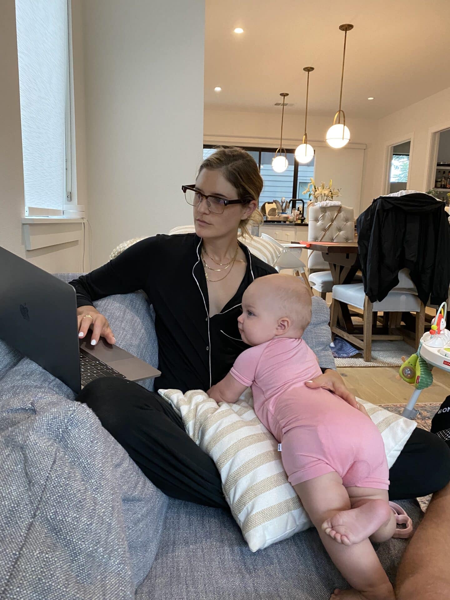 Caroline Stone Peters working at home with baby