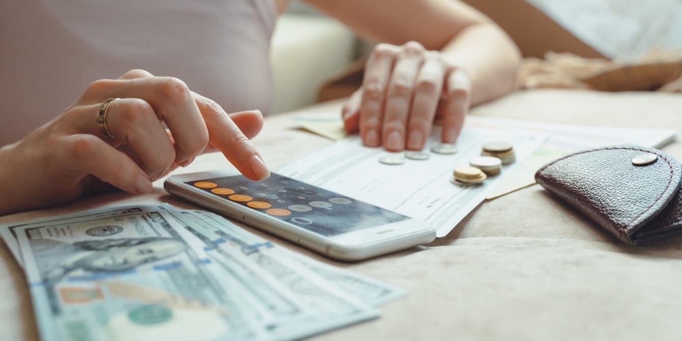 Learning to trust yourself with money woman counting money- heal your relationship with money