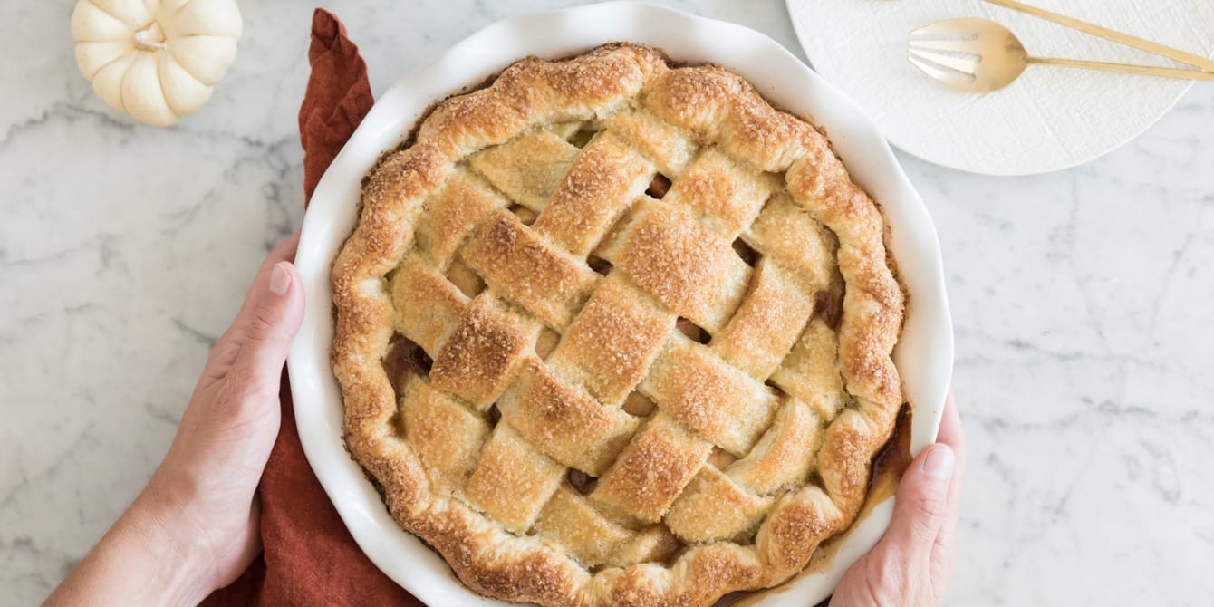 All the things you can make with apples hands holding apple pie- what to make with apples
