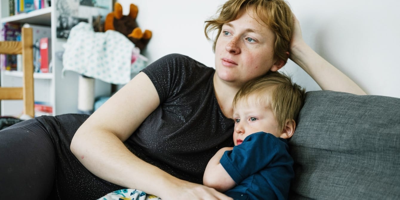 I miss the village of motherhood I never got to experience mom and son cuddled on couch - raising children in community