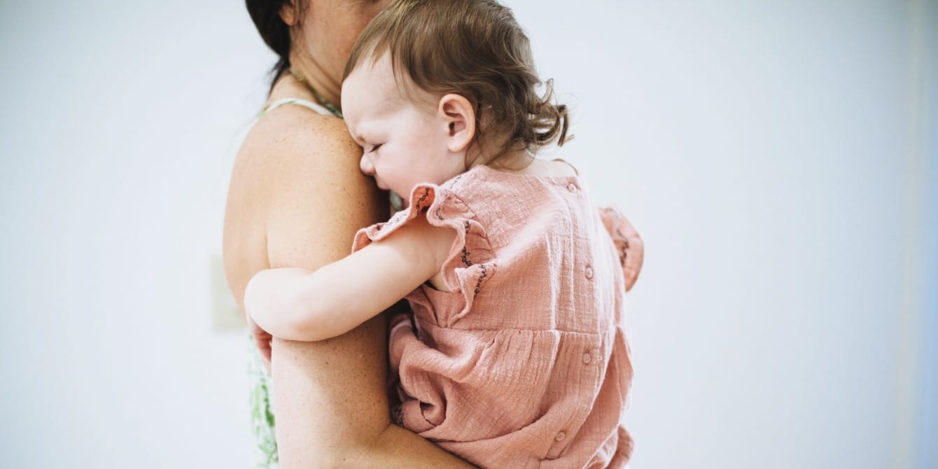 Be the pier, not the ocean: On taming tantrums mother holding upset toddler daughter - taming tantrums
