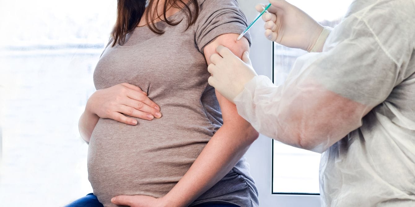 pregnant woman getting vaccine 1 - Motherly