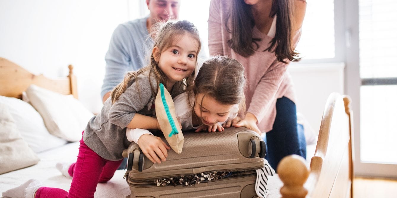 How to set realistic expectations for Thanksgiving travel with kids family packing for trip- thanksgiving travel with kids