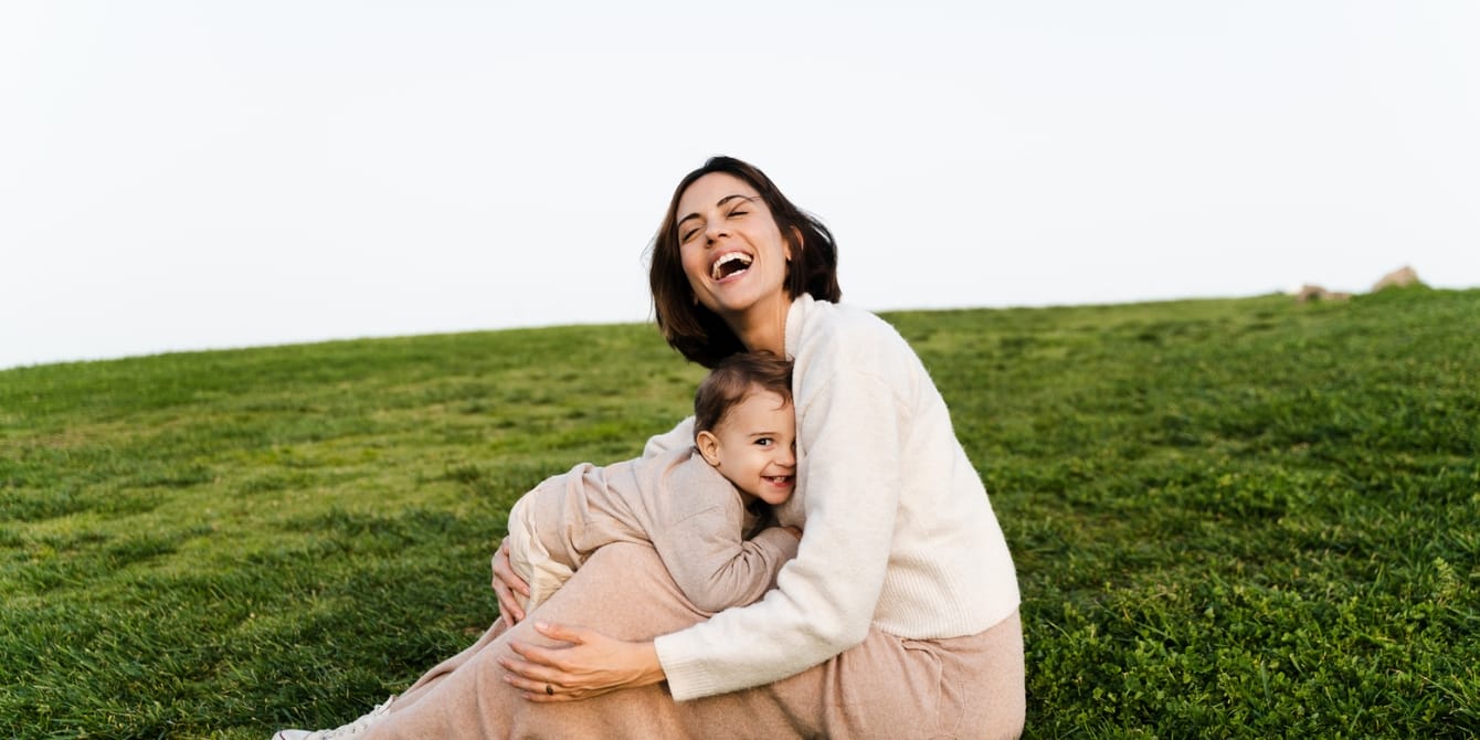 Mothers are their children’s ‘happiness anchors’ happy mom and toddler outside - happiness anchors