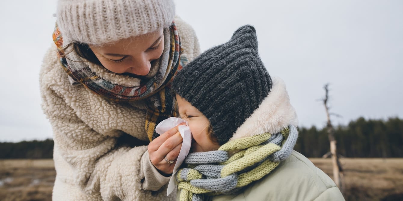 TikTok pediatrician reminds everyone you don’t get sick from weather mom helping child to blow nose cold doesn't make you sick catch a cold from being cold
